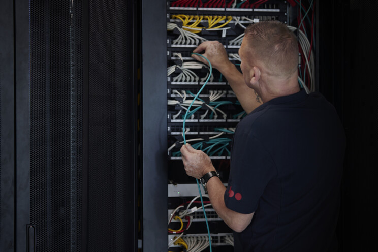 Employee working on data servers