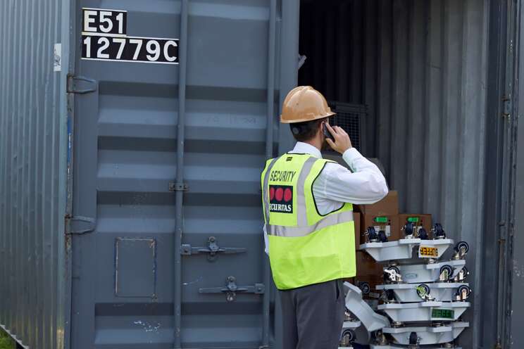 Securitas On-site Guarding Officer inspects a container at a client site.